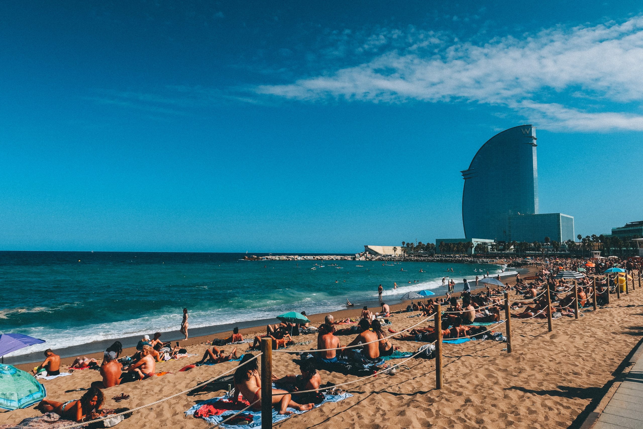 barceloneta beach sunbathing scaled
